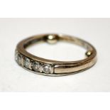 9ct white gold channel set diamond ring. Size K 1/2 with size reducing nibs to inside of band