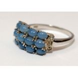 A 925 silver and light blue 12 stone ring Size O