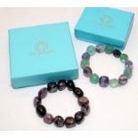 Two boxed gemstones bracelets, one Flourite and the other Charoite