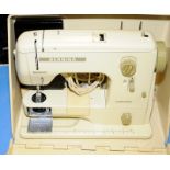 A Bernina sewing machine in case.