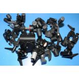 A collection of Manfrotto T clamps, tripod heads and other accessories
