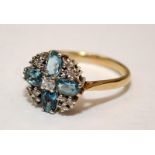 9ct gold dress ring set with blue topaz and diamonds. Size O