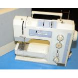 A Bernina sewing machine in case.