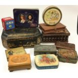 Collection of wooden boxes and commemorative tins.
