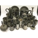 Large collection of antique pewter items.