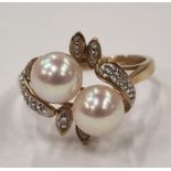 A 9ct gold pearl and diamond ring Size N