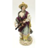 19th Century Portschappel porcelain figure of a Turkish woman playing a Hurdy Gurdy wearing a