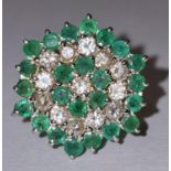 An 18ct gold emerald and diamond daisy ring, 5.8g Size L