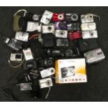 Large collection of compact digital cameras and camcorders.