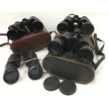Four pairs of binoculars three of which are cased.
