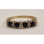 A 9ct gold eternity band set with sapphires size Q