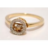 Unusual 9ct gold diamond halo ring with suspended animated centre section in a daisy setting. Size N
