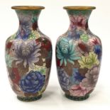 Pair of oriental cloisonne vases each measuring 19cm tall.