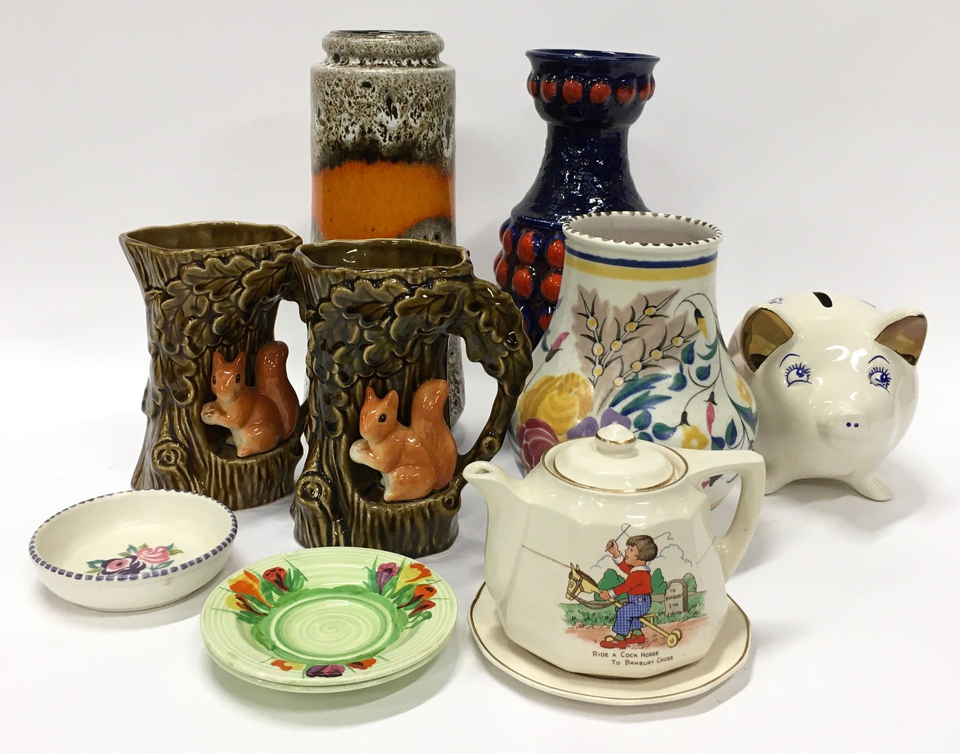 Mixed ceramics to include Sylvac, Clarice Cliff, West German Lava and Poole Pottery.