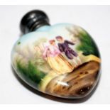 Antique porcelain heart shaped perfume bottle with hand painted scene featuring a young couple,