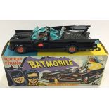 Corgi 267 "Batman" - Batmobile - black body, red bat hubs, blue tinted windows with "Batman and