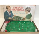 A Caslon Football boxed game along with a Super Soccer boxed game.