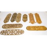 A collection of antique solid brass door finger plates. 9 in total, the largest being approx