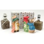 Two boxed Beatrix Potter figurines together with two Poole Pottery Barbara Linley Adams lamp