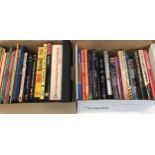 2 boxes containing a quantity of soft and hardback books relating to comics, film stars and comic
