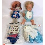Tiny Tears doll with closing eyes and a selection of various clothing along with a rag doll and some