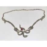 A silver ruby set snake necklace.