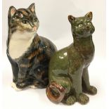 Two ceramic cat figurines the largest measuring 31cm.