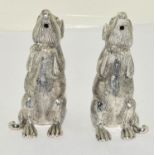 A pair of silver plated mouse shaped condiments.