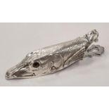 A silver plated fish style document clip.