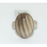 A brand new with tag oval 925 silver and agate ring Size N