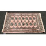 Contemporary dusky pink patterned carpet 120x78cm.