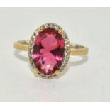 A silver CZ and Tourmaline ring. Size R
