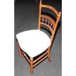Edwardian bedroom chair with faux bamboo frame and bobbin back panel. Seat height 44cms