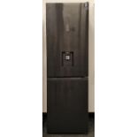 A Hisense black modern fridge freezer. Looks to have been barely used.185x58x57cm.