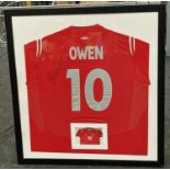 Framed and glazed signed Michael Owen England football shirt 85x80cm.