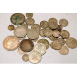A collection of silver coins to include an 1885 Morgan Dollar and a 1932 Netherlands 2 1/2 Gulden