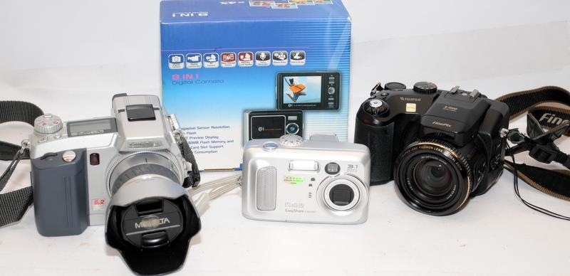 Small collection of digital cameras to include a Fuji Finepix S7000. On behalf of Age Concern