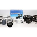 Small collection of digital cameras to include a Fuji Finepix S7000. On behalf of Age Concern
