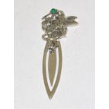 A silver bookmark with fairy finial set with emerald cabochon