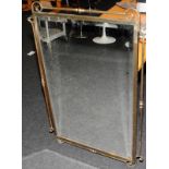 Large bevelled edge mirror in a bronzed cast metal frame. O/all size 107cms x 74cms
