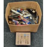 Box containing large collection of boxed and unboxes souvenir teaspoons.