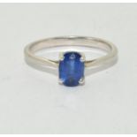 A 925 silver TGGC ring with blue solitaire, Size O