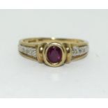 A 9CT GOLD LADIES DIAMOND & RUBY RING. H/M DIA IN RING. SIZE N.