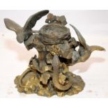 cast brass tableau of a pair of birds protecting their eggs from a snake. 25cms across