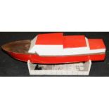 Large vintage wooden model motorboat on stand with fitted motor. Approx 123cms across