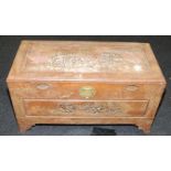 Vintage camphorwood coffer with carved exterior featuring Oriental scenes. 94cms x 46cms x 50cms