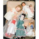 Vintage suitcase containing a number of dolls