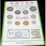 Presentation sheet ' Money of Korea' featuring Memory coins of Yi dynasty alongside 20th Century