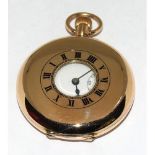 9ct gold side wind half hunter pocket watch set with enamel face and roman numerals with