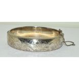 Silver embossed ladies hinged bangle with safety chain 7cm diameter